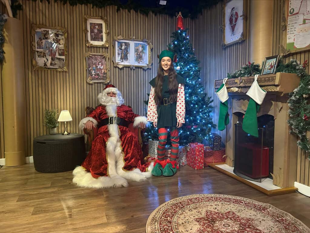 Santa and Twinkle the elf in Life's grotto.