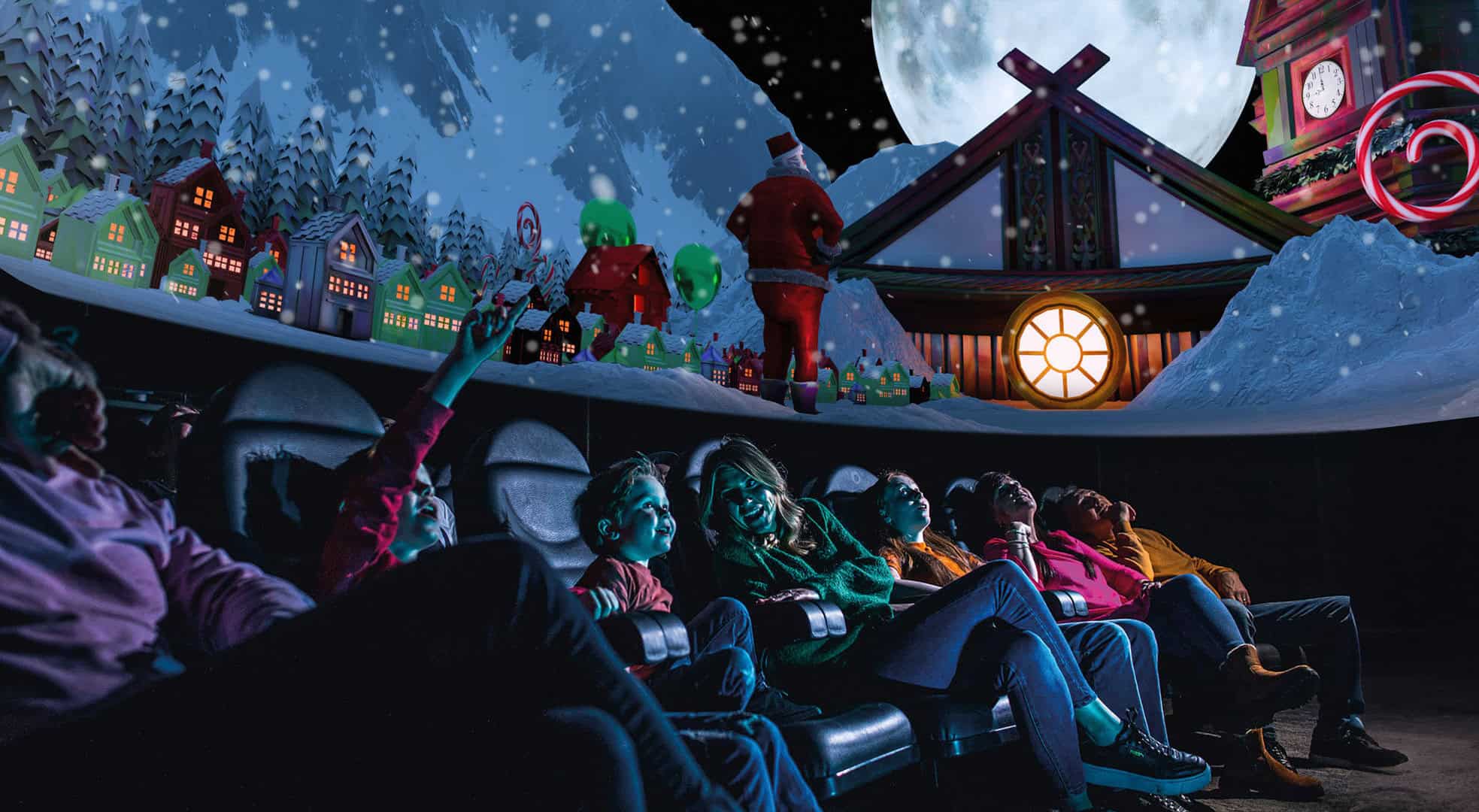 Family enjoying 'What Santa Sees' in Life Science Centre's Planetarium.
