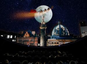 Overhead shot of santa flying over Newcastle skyline during 'What Santa Sees' planetarium show.