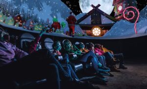 A family in the planetarium watching What Santa Sees