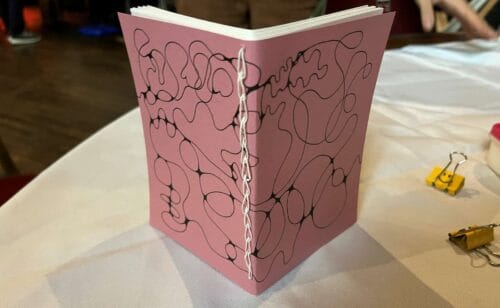 Families can make a handmade notebook in The Making Studios.