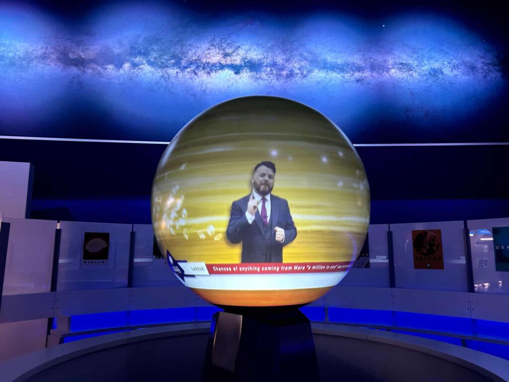 ITV News' Ross Hutchinson presenting an interplanetary weather forecast on Life Science Centre's Sphere.