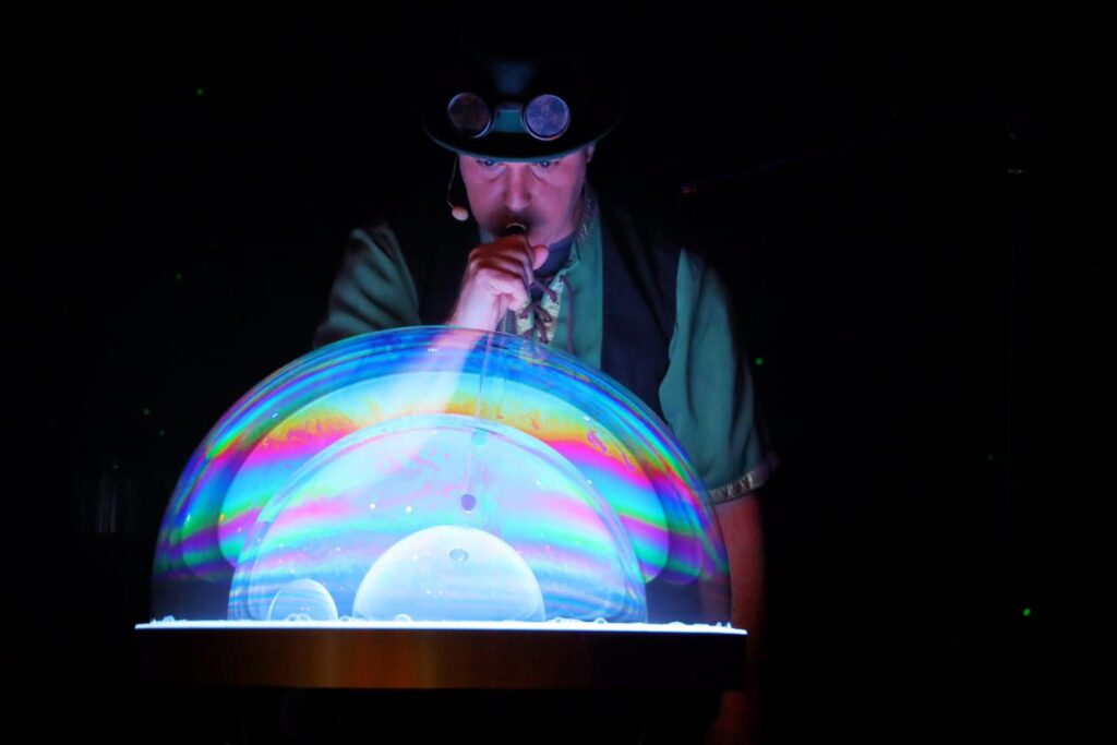 The Highland Joker blowing a large bubble during show.