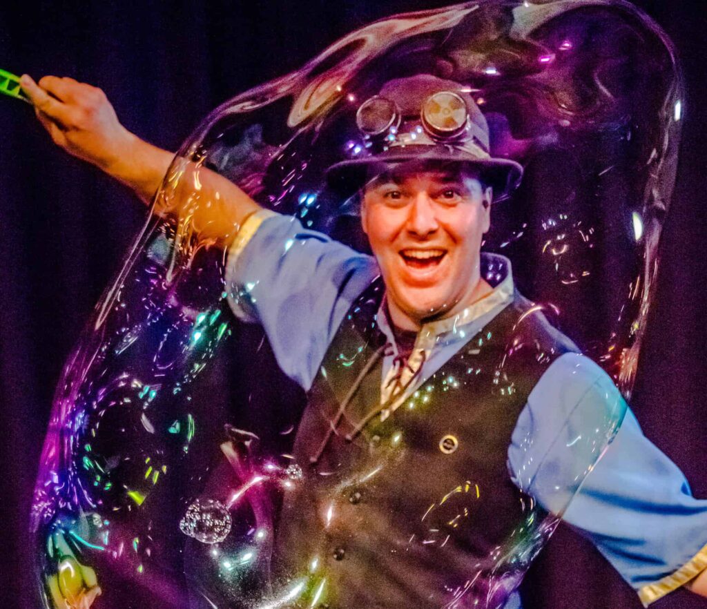 The Highland Joker In Giant Bubble During Exciting Science Show.