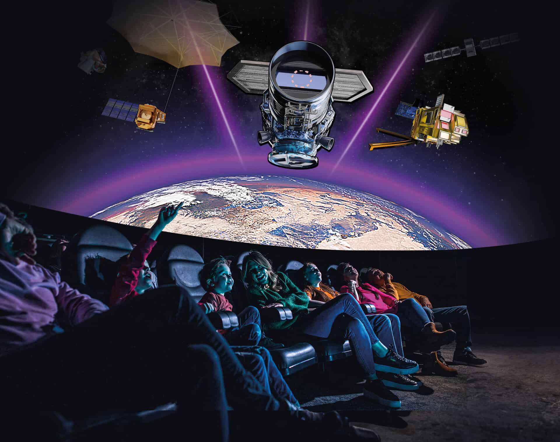 Family in Life Science Centre planetarium sitting down to watch new Earth Defenders show.