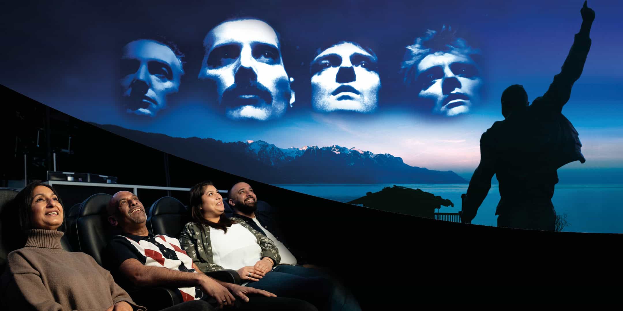 Adults looking up to watch Queen planetarium show at Life Science Centre.