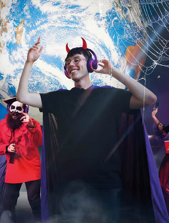 Man dancing at Halloween themed silent disco at Life Science Centre in Newcastle.