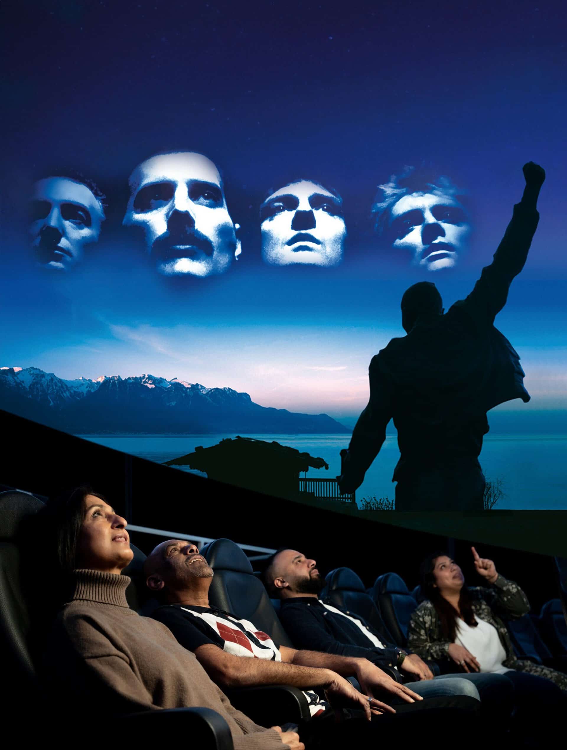 Adults looking up to watch Queen planetarium show at Life Science Centre.