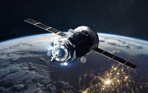 Space ship on orbit of Earth planet. Expedition of cargo spacecraft to ISS. Deep space and cities lights. Elements of this image furnished by NASA.