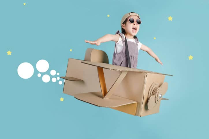 Asian Little Child Girl Playing With Cardboard Toy Airplane Handicraft Isolated On Blue Long Banner With Copy Space For Your Text, Creative With Family And Dreaming Of Flying Concept