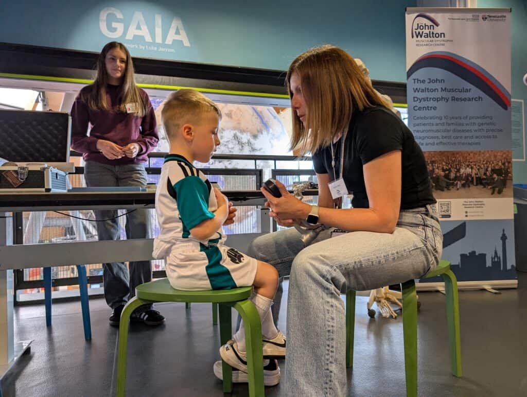 Little Boy Taking Part In Science Demo At Spotlight On Space Day.