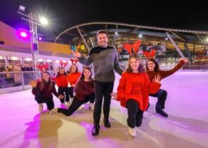Joe McElderry with figure skaters at Life Science Centre's ice rink launch event.