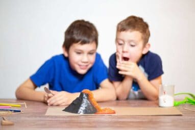 Two Boys Watching A Chemistry Experiment