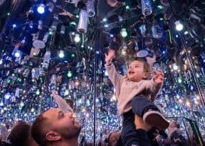 Parent and child looking up in Infinity Room - a new interactive exhibit at Newcastle's Life Science Centre.