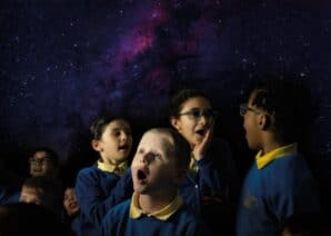 Edina school children in Life Science Centre's mobile Planetarium, looking up in amazement at the stars and planets.