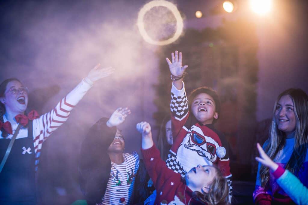 Children playing with smoke rings during a Santa Experience session at Newcastle's Life Science Centre.