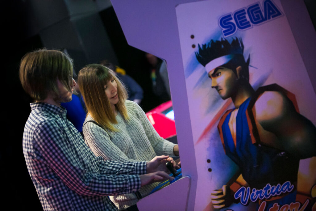 Young adults enjoying Centre for Life's Game On exhibit back in 2019.