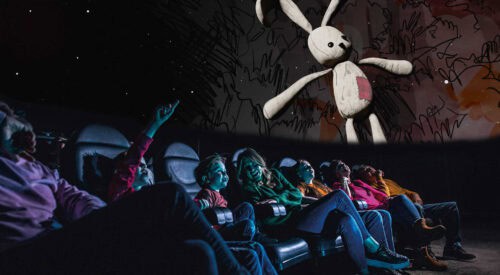 Family in Life Science Centre Planetarium looking up at at bunny toy which features in in Bump in the Night show.