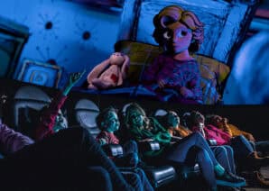 Family in Life Science Centre Planetarium looking up at animated girl in bed with bunny in Bump in the Night show.