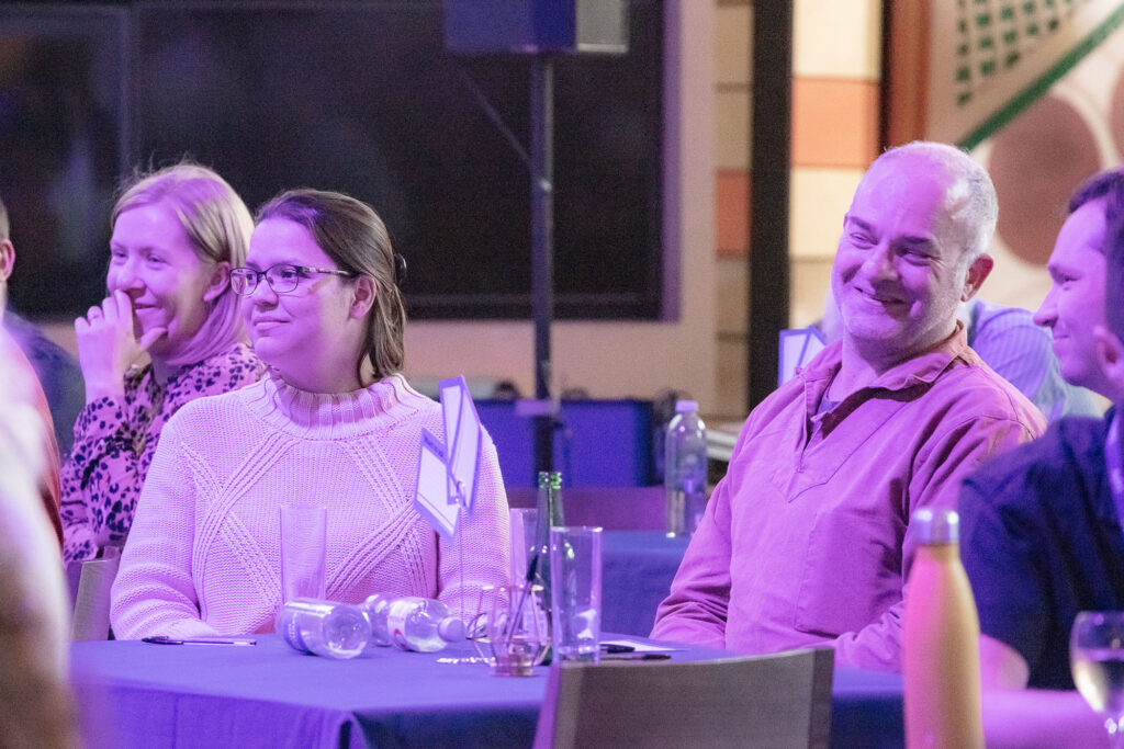 Adults enjoying an evening debate at Newcastle's Life Science Centre.