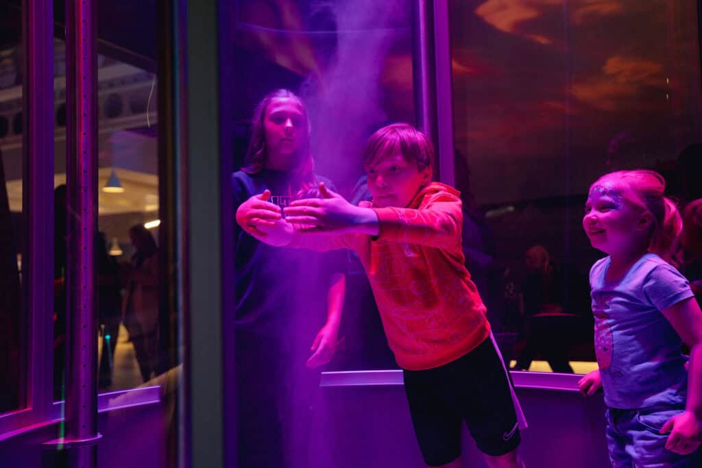Children experimenting with a tornado in Life Science Centre's Lightbox.