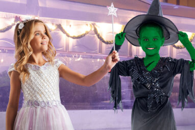 Children dressed as Glinda and Elphaba from the movie Wicked on Life Science Centre's ice rink.