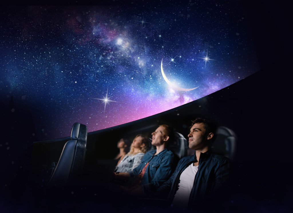 Adults sat in Life Science Centre's huge planetarium, looking up to watch Live Skies Show.