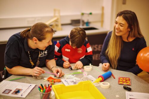 Family in home education workshop.