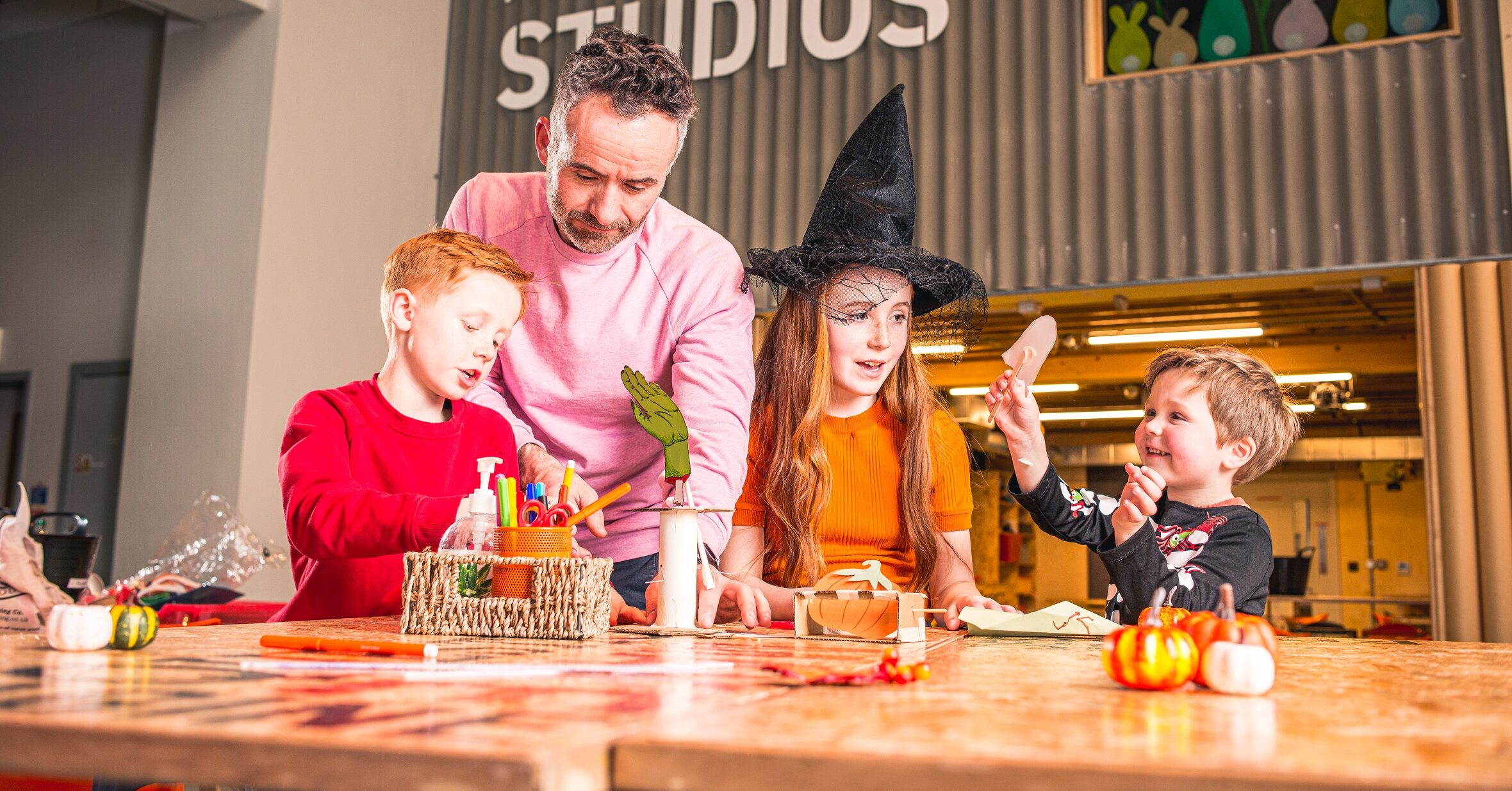 Family in Making Studios dressed in Halloween attire