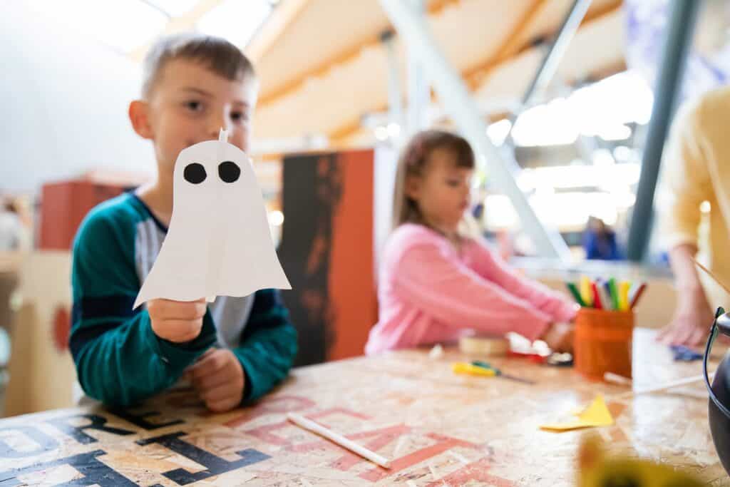 Little boy holding a ghost in Making Studios.