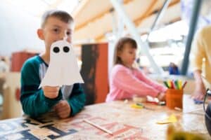 Little boy holding a ghost in Making Studios.