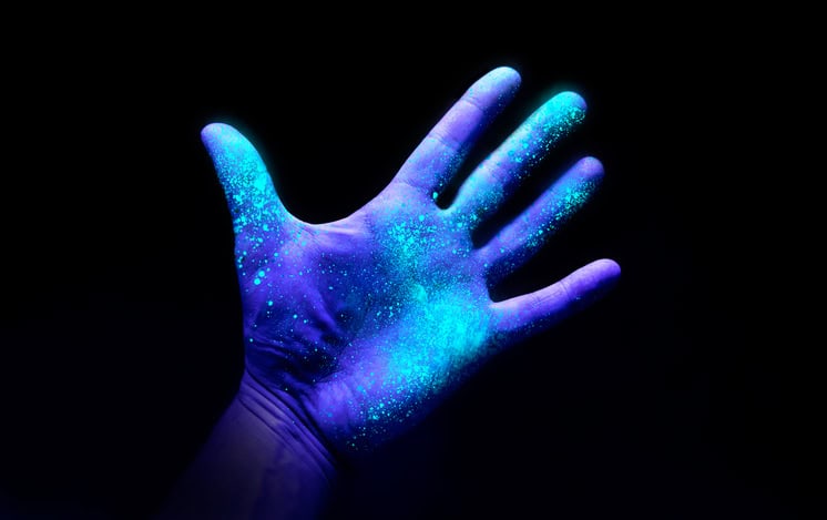 Ultraviolet Light On A Hand Showing Bacteria Growth