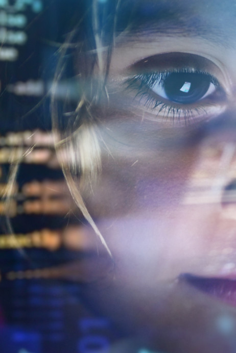 Close Up Of A Little Girl Looking At Some Futuristic coding on a screen