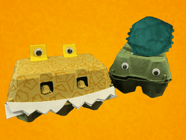 Coloured egg boxes with teeth and googly eyes - made to look like dinosaurs.