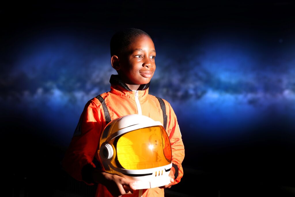Young boy pictured in astronaut suit inside Newcastle's Life Science Centre.
